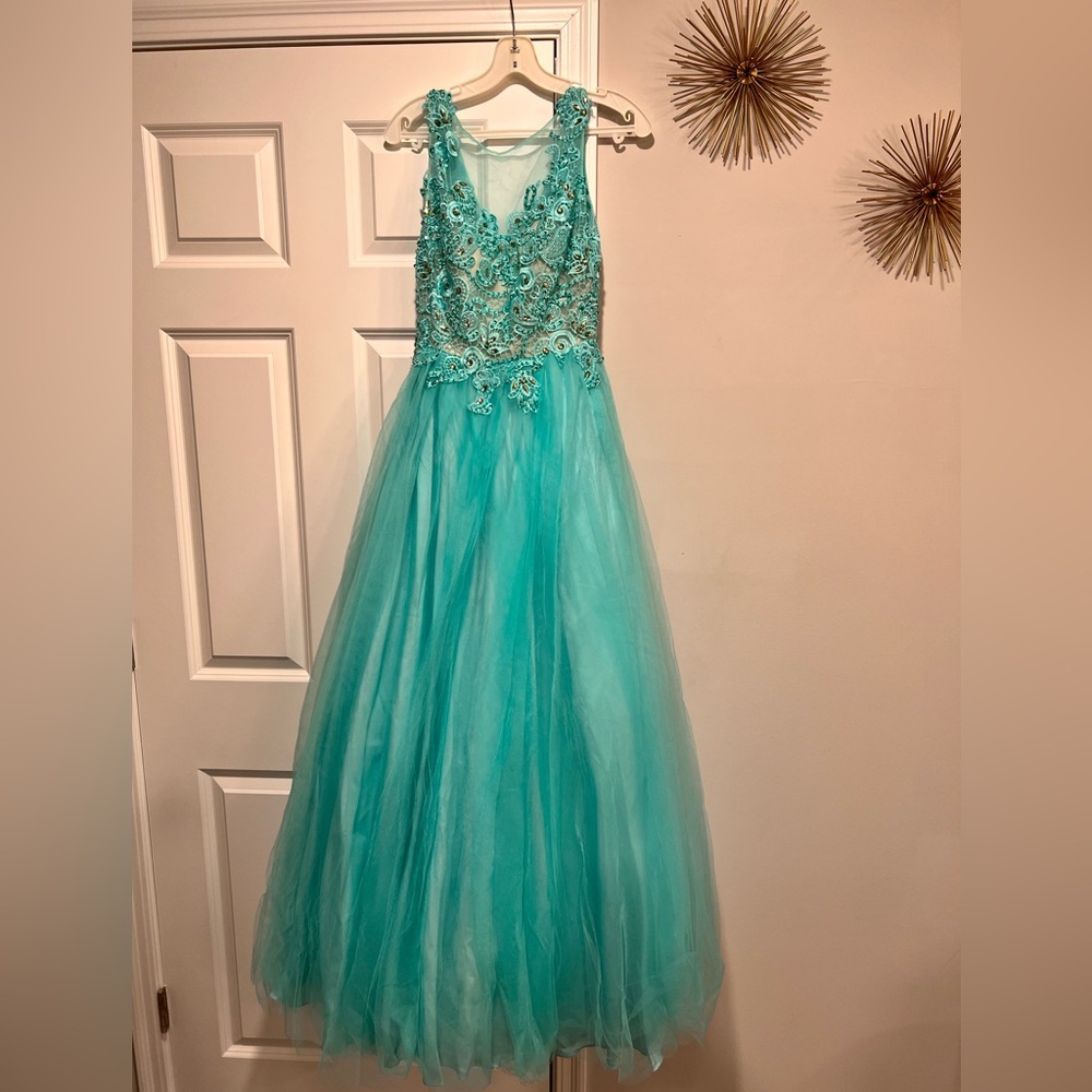 Wore once in 2015 for Prom and it has been in this plastic since then.